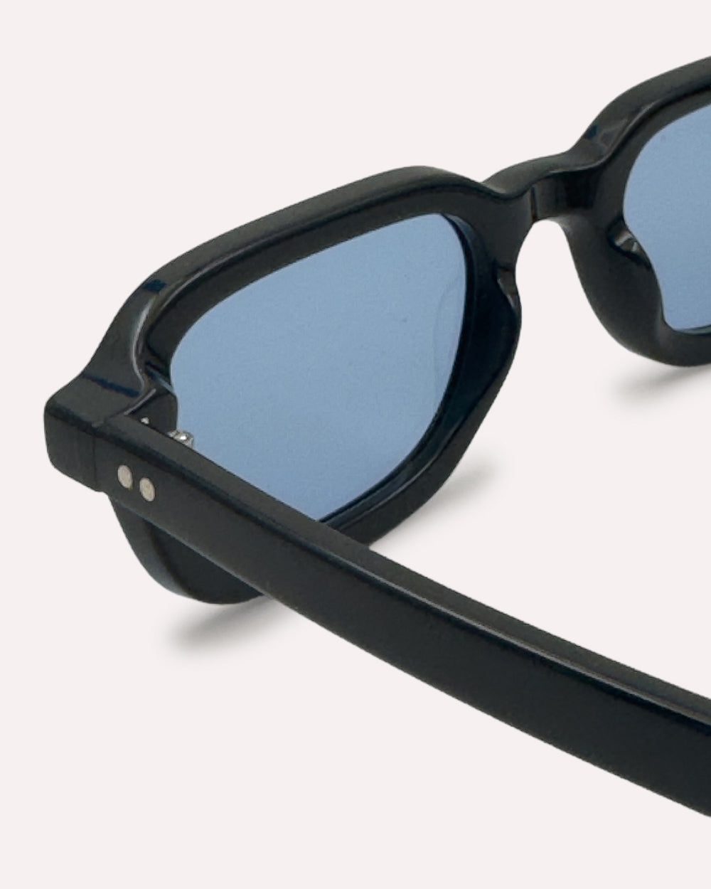Plein Air Eyewear Cassatt sunglasses, black acetate frame with blue lenses, detail of Italian acetate and hinge