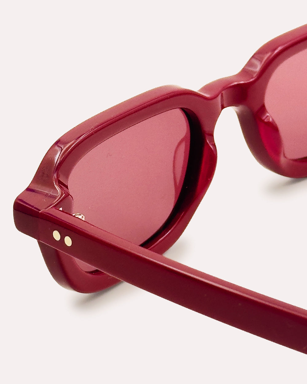 Plein Air Eyewear Cassatt sunglasses, red acetate frame with red lenses, detail of Italian acetate and hinge