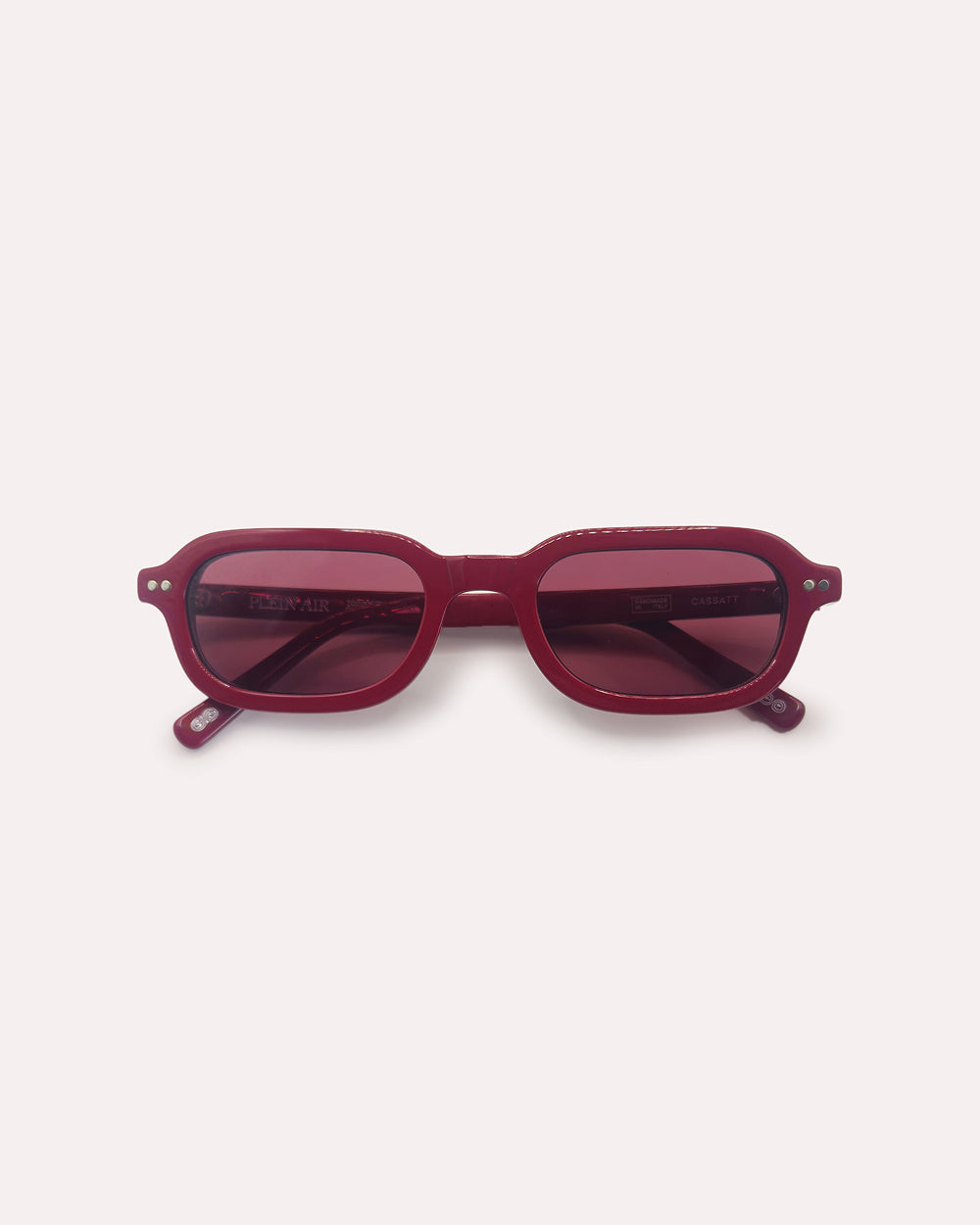 Plein Air Eyewear Cassatt sunglasses, red acetate frame with red lenses, folded
